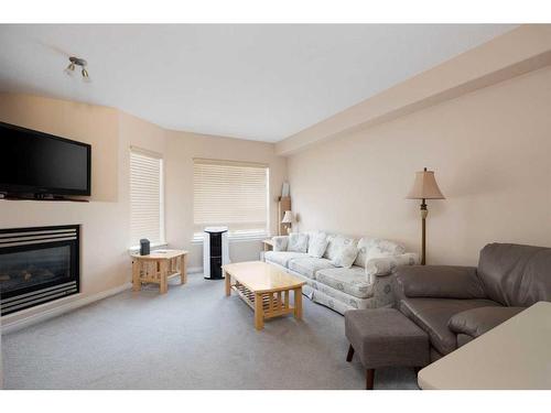 305-123 Arabian Drive, Fort Mcmurray, AB - Indoor Photo Showing Living Room With Fireplace