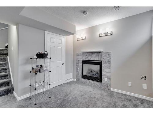 197 Kodiak Crescent, Fort Mcmurray, AB - Indoor Photo Showing Other Room With Fireplace