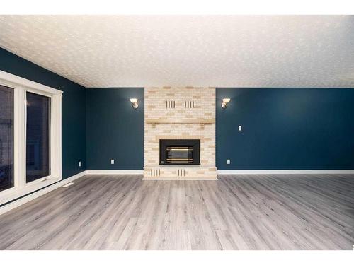 176 Torrie Bay, Fort Mcmurray, AB - Indoor Photo Showing Living Room With Fireplace