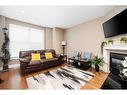 107 Sandpiper Road, Fort Mcmurray, AB  - Indoor Photo Showing Living Room With Fireplace 