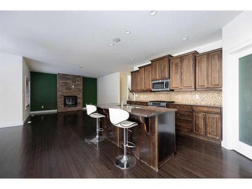 172 Gravelstone Way, Fort Mcmurray, AB - Indoor Photo Showing Kitchen With Fireplace