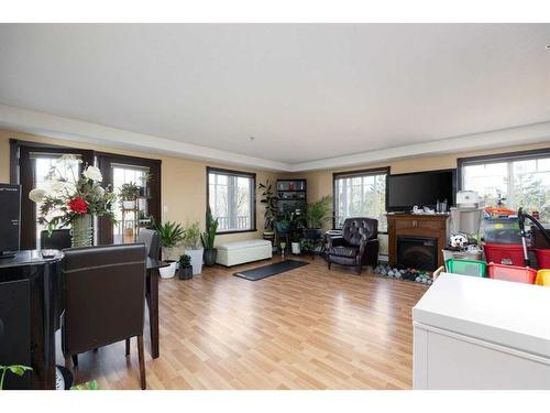 202-10217 Queen Street, Fort Mcmurray, AB - Indoor Photo Showing Living Room With Fireplace