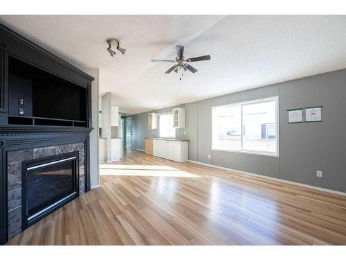 248 Harpe Way, Fort Mcmurray, AB - Indoor Photo Showing Living Room With Fireplace