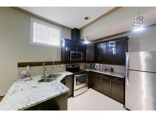 145 Stonecreek Landing, Fort Mcmurray, AB - Indoor Photo Showing Kitchen With Double Sink