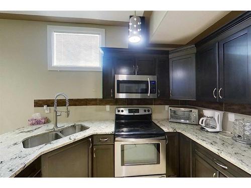 145 Stonecreek Landing, Fort Mcmurray, AB - Indoor Photo Showing Kitchen With Double Sink With Upgraded Kitchen