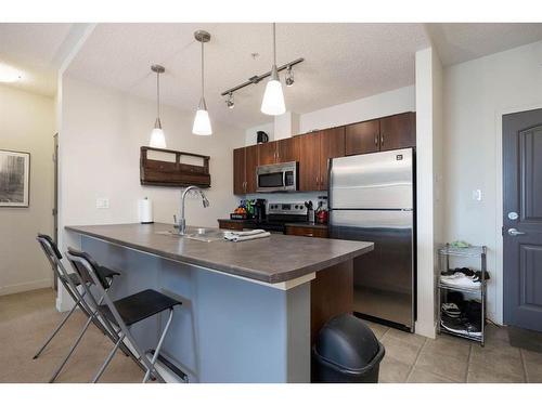 409-136B Sandpiper Road, Fort Mcmurray, AB - Indoor Photo Showing Kitchen With Double Sink