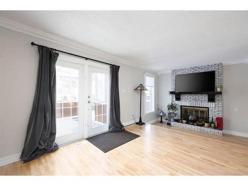 113 Goodwin Place, Fort Mcmurray, AB - Indoor Photo Showing Living Room With Fireplace