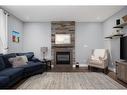 112 Comeau Crescent, Fort Mcmurray, AB  - Indoor Photo Showing Living Room With Fireplace 