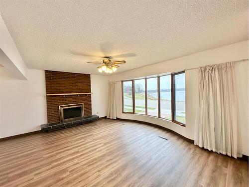 10205 105 Street, Lac La Biche, AB - Indoor Photo Showing Other Room With Fireplace