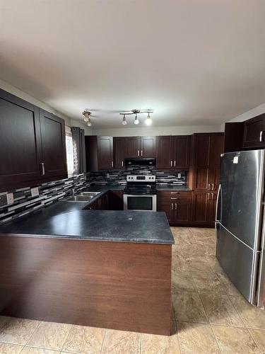 217 Hillcrest Drive, Fort Mcmurray, AB - Indoor Photo Showing Kitchen With Double Sink