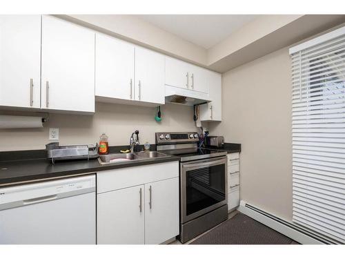 324-201 Abasand Drive, Fort Mcmurray, AB - Indoor Photo Showing Kitchen With Double Sink