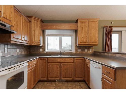 113 Paris Crescent, Fort Mcmurray, AB - Indoor Photo Showing Kitchen With Double Sink