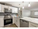 409-115 Denholm Gate, Fort Mcmurray, AB  - Indoor Photo Showing Kitchen With Double Sink 