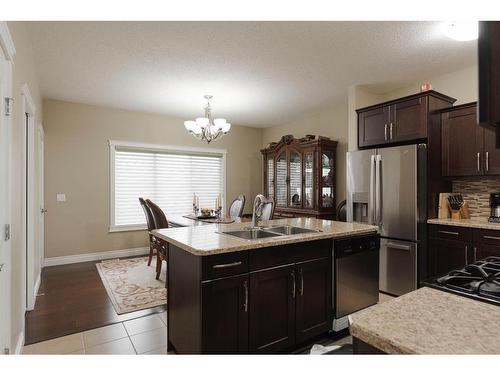 6-300 Sparrow Hawk Drive, Fort Mcmurray, AB - Indoor Photo Showing Kitchen With Stainless Steel Kitchen With Double Sink