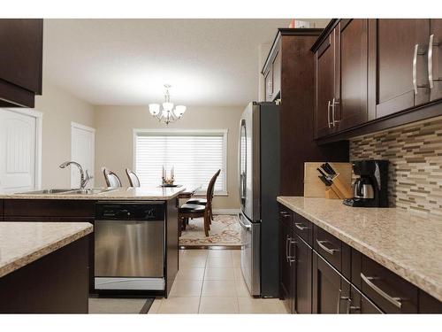 6-300 Sparrow Hawk Drive, Fort Mcmurray, AB - Indoor Photo Showing Kitchen With Stainless Steel Kitchen With Double Sink