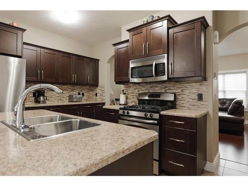 6-300 Sparrow Hawk Drive, Fort Mcmurray, AB - Indoor Photo Showing Kitchen With Stainless Steel Kitchen With Double Sink With Upgraded Kitchen