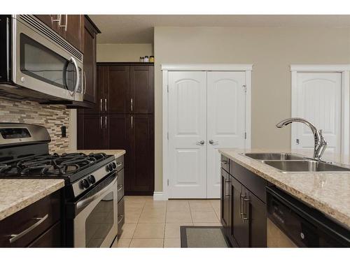 6-300 Sparrow Hawk Drive, Fort Mcmurray, AB - Indoor Photo Showing Kitchen With Double Sink