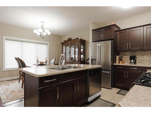 6-300 Sparrow Hawk Drive, Fort Mcmurray, AB - Indoor Photo Showing Kitchen With Stainless Steel Kitchen With Double Sink