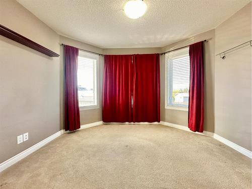 #210-10212 101 Street, Lac La Biche, AB - Indoor Photo Showing Other Room