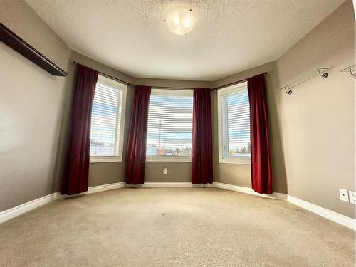 #210-10212 101 Street, Lac La Biche, AB - Indoor Photo Showing Other Room