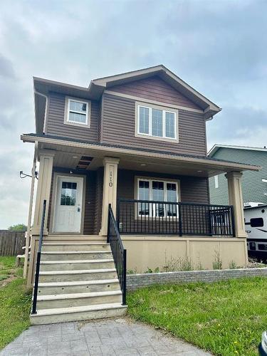 110-10209 92 Avenue, Lac La Biche, AB - Outdoor With Deck Patio Veranda With Facade