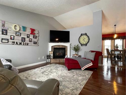 236 Shetland Garden, Fort Mcmurray, AB - Indoor Photo Showing Living Room With Fireplace