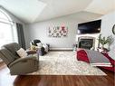 236 Shetland Garden, Fort Mcmurray, AB  - Indoor Photo Showing Living Room With Fireplace 