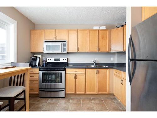 72-400 Silin Forest Road, Fort Mcmurray, AB - Indoor Photo Showing Kitchen With Stainless Steel Kitchen With Double Sink