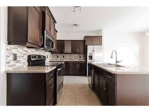 11-300 Sparrow Hawk Drive, Fort Mcmurray, AB - Indoor Photo Showing Kitchen With Double Sink With Upgraded Kitchen