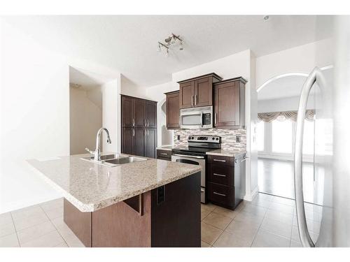 11-300 Sparrow Hawk Drive, Fort Mcmurray, AB - Indoor Photo Showing Kitchen With Double Sink