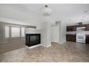 16-120 Warren Way, Fort Mcmurray, AB  - Indoor Photo Showing Kitchen With Fireplace 