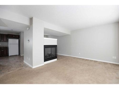 16-120 Warren Way, Fort Mcmurray, AB - Indoor With Fireplace