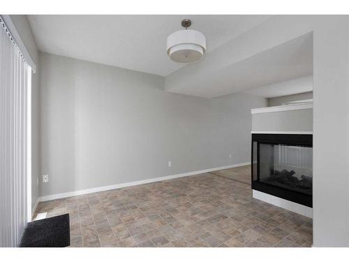 16-120 Warren Way, Fort Mcmurray, AB - Indoor Photo Showing Other Room With Fireplace