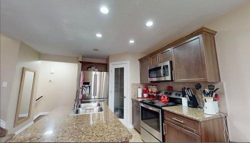 169 Dakin Drive, Fort Mcmurray, AB - Indoor Photo Showing Kitchen With Stainless Steel Kitchen With Double Sink