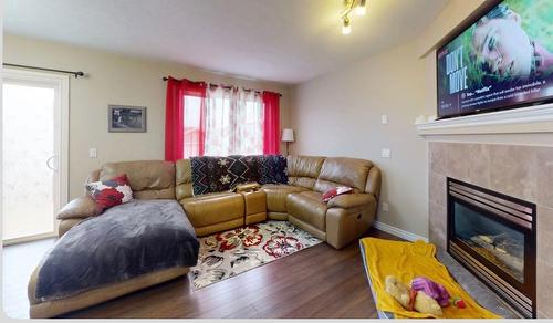 169 Dakin Drive, Fort Mcmurray, AB - Indoor Photo Showing Living Room With Fireplace