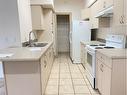 213-9918 Gordon Avenue, Fort Mcmurray, AB  - Indoor Photo Showing Kitchen With Double Sink 