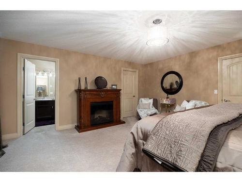 221 Paris Crescent Nw, Fort Mcmurray, AB - Indoor Photo Showing Bedroom With Fireplace