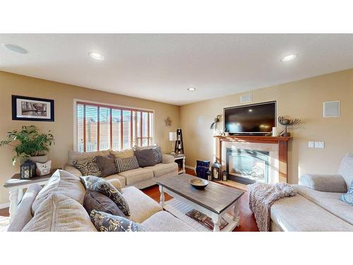 201 Pickles Crescent, Fort Mcmurray, AB - Indoor Photo Showing Living Room With Fireplace