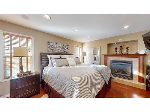 201 Pickles Crescent, Fort Mcmurray, AB - Indoor Photo Showing Bedroom With Fireplace