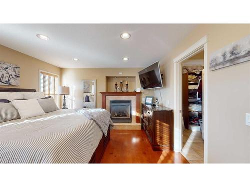 201 Pickles Crescent, Fort Mcmurray, AB - Indoor Photo Showing Bedroom With Fireplace