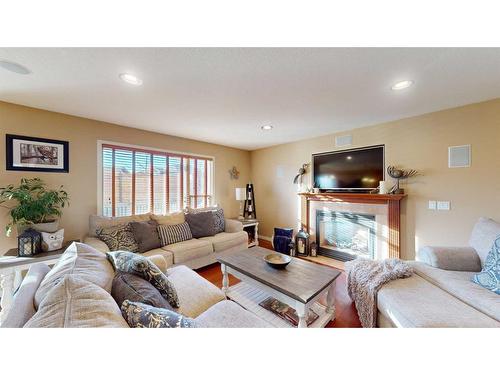 201 Pickles Crescent, Fort Mcmurray, AB - Indoor Photo Showing Living Room With Fireplace