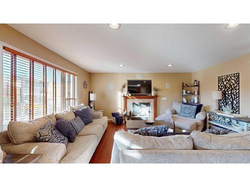 201 Pickles Crescent, Fort Mcmurray, AB - Indoor Photo Showing Living Room With Fireplace