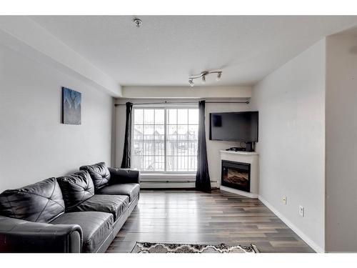 3307-200 Lougheed Drive, Fort Mcmurray, AB - Indoor Photo Showing Living Room With Fireplace