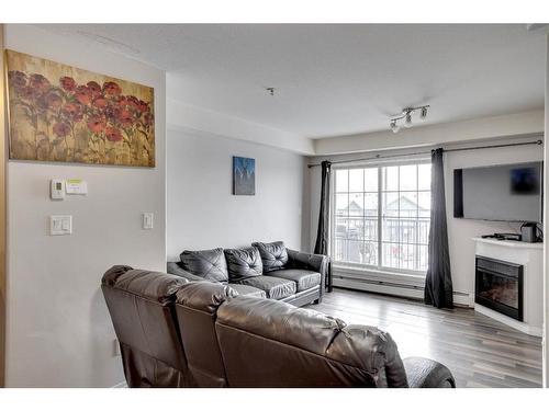 3307-200 Lougheed Drive, Fort Mcmurray, AB - Indoor Photo Showing Living Room With Fireplace