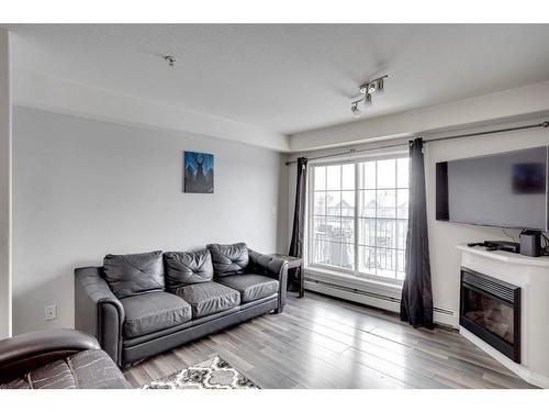 3307-200 Lougheed Drive, Fort Mcmurray, AB - Indoor Photo Showing Living Room With Fireplace