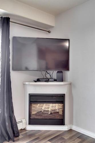 3307-200 Lougheed Drive, Fort Mcmurray, AB - Indoor Photo Showing Living Room With Fireplace