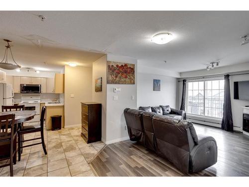 3307-200 Lougheed Drive, Fort Mcmurray, AB - Indoor Photo Showing Living Room With Fireplace