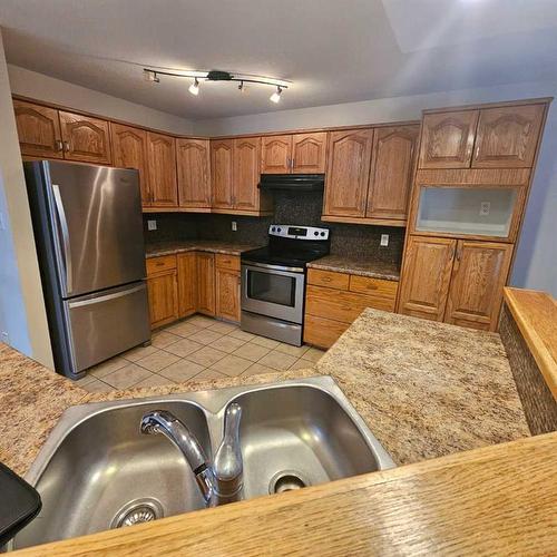 9517 91 Street, Lac La Biche, AB - Indoor Photo Showing Kitchen With Double Sink