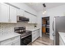 209-290 Plamondon Drive, Fort Mcmurray, AB  - Indoor Photo Showing Kitchen With Stainless Steel Kitchen 