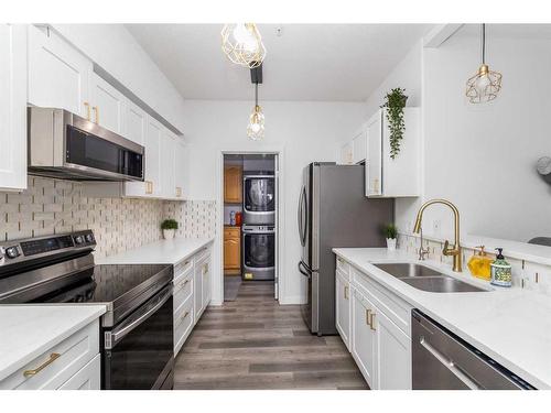 209-290 Plamondon Drive, Fort Mcmurray, AB - Indoor Photo Showing Kitchen With Stainless Steel Kitchen With Double Sink